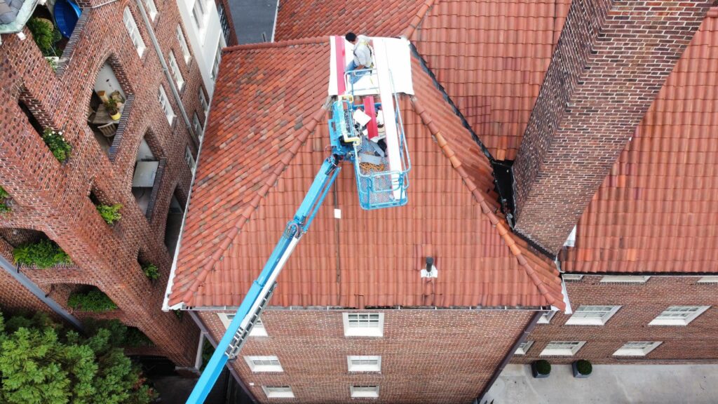 Boom lift roof repair